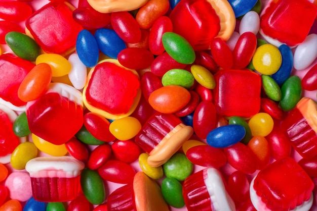 Background of colorful candies in different shapes