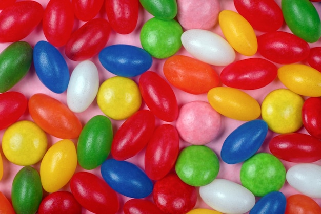 Background of colorful candies in different shapes