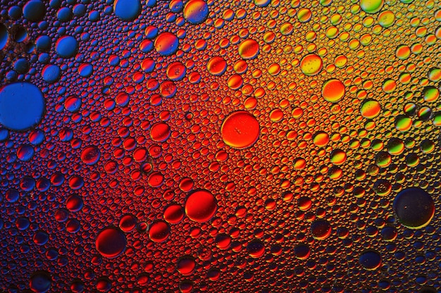 Background of colorful oil drops in water surface