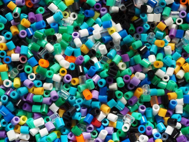 Background of colorful plastic beads in blue tones