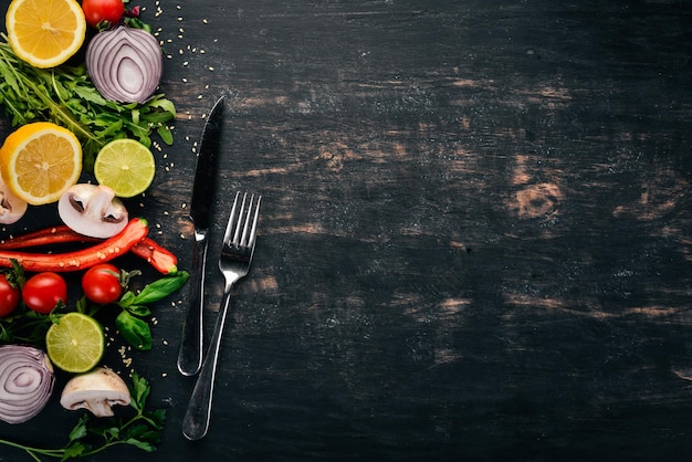 Photo the background of cooking fresh vegetables on a wooden surface top view copy space