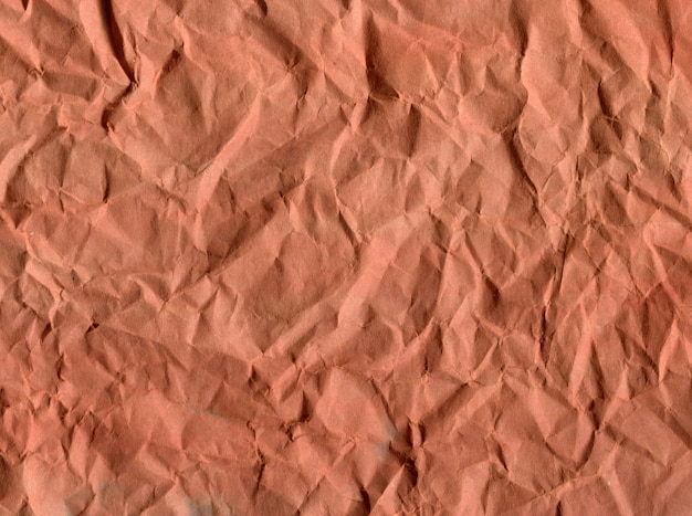 Background crumpled paper of brown shades