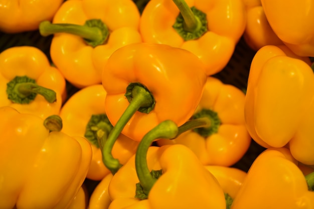 Background cut yellow sweet pepper in a basket