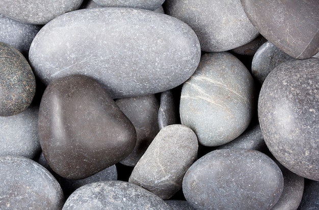 Background of the dark sea stones