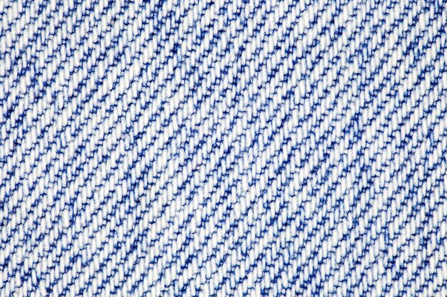 Background denim fabric closeup white and blue threads uniform texture