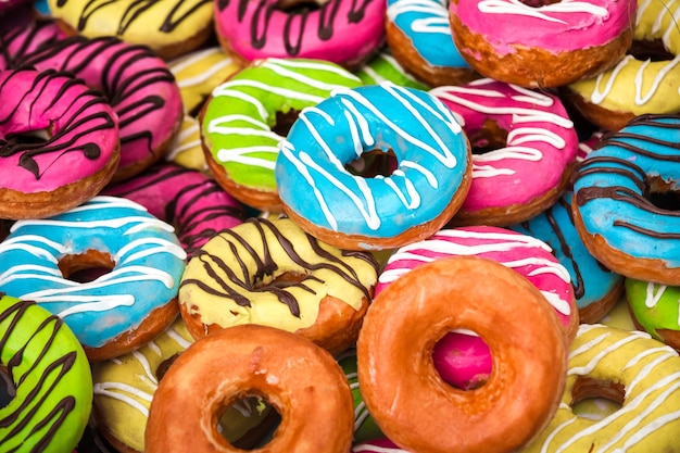 Background of different colorful donuts