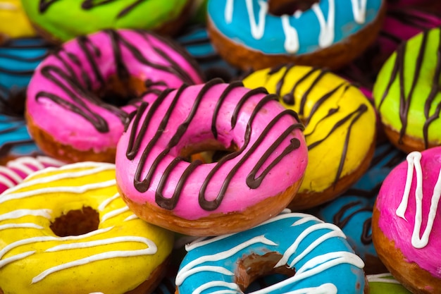 Background of different colorful donuts