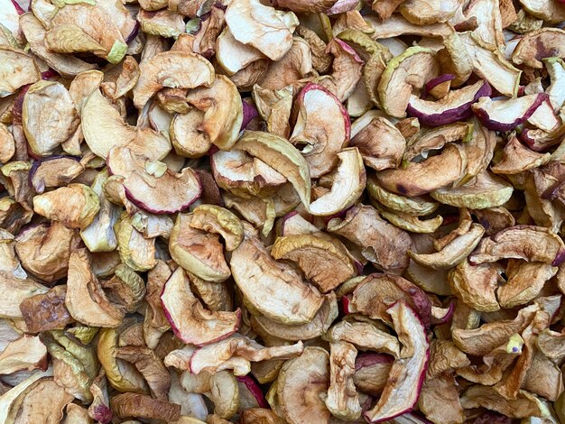 Background of dried apples in closeup Texture of dried apple