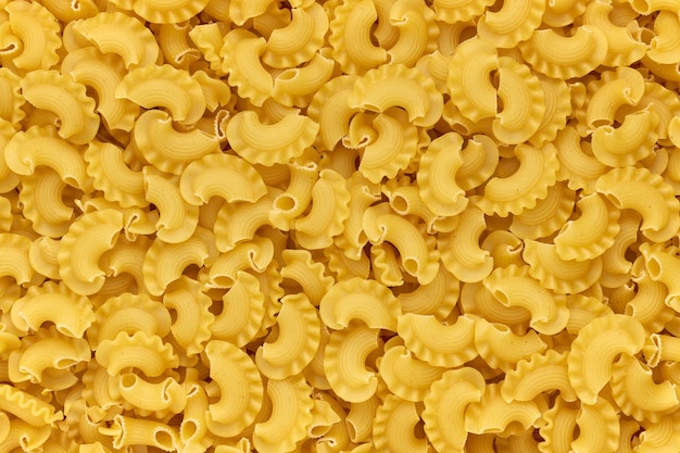 Background of dried macaroni cockerel scallops close up