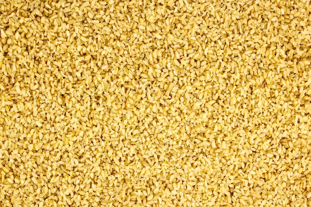 background of dry bulgur wheat from above