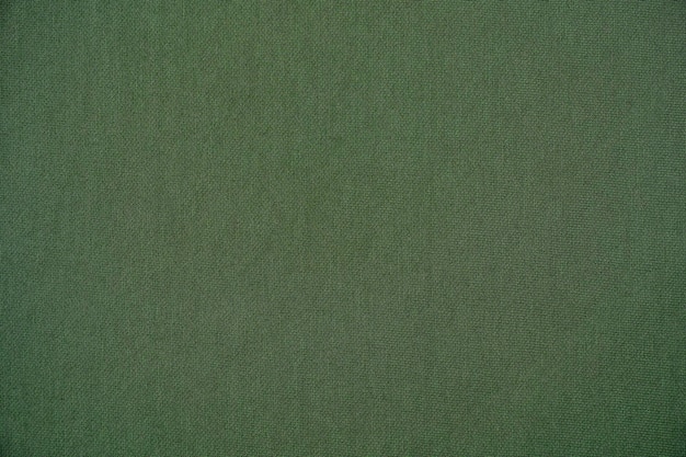 Background fabric texture of green color closeup
