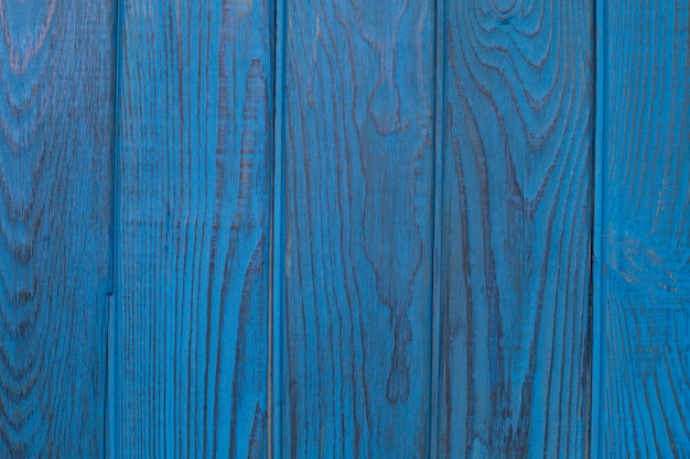 Background of five vertical blue painted boards