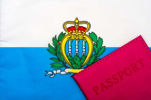 On the background of the flag of San Marino is a passport