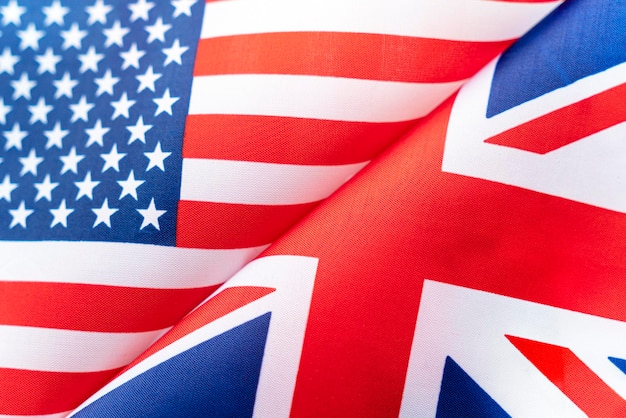 Background of the flags of the usa and great britain the\
concept of interaction or counteraction between two countries\
international relations political negotiations sports\
competition