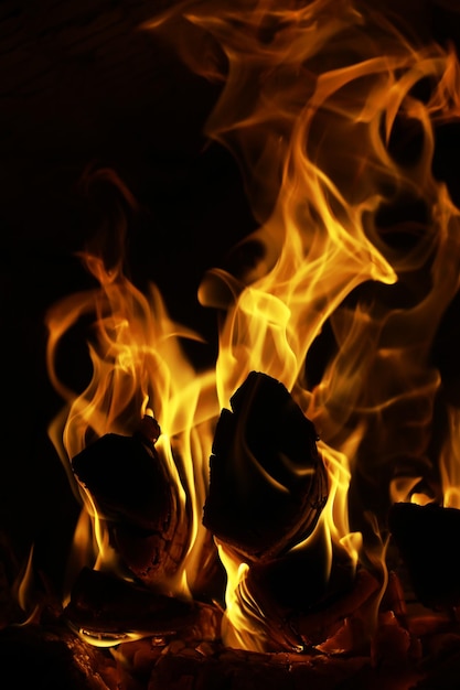 Background of the flame in the oven Tongues of fire in a brick fireplace Fire texture