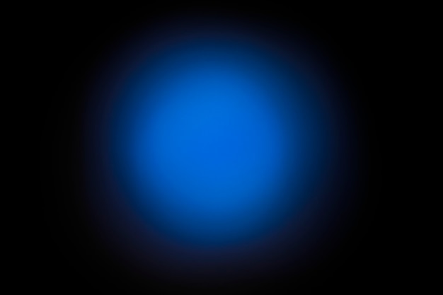 Background in the form of a blue gradient bokeh. Black background.