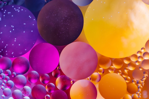 Background in the form of multicolored circles. Made of oil drops.
