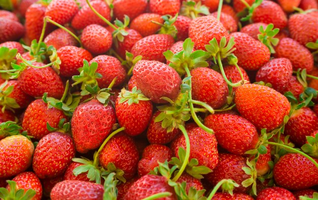 Background formed of fresh red strawberries