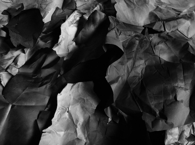 Background of fragments of crumpled paper black and white