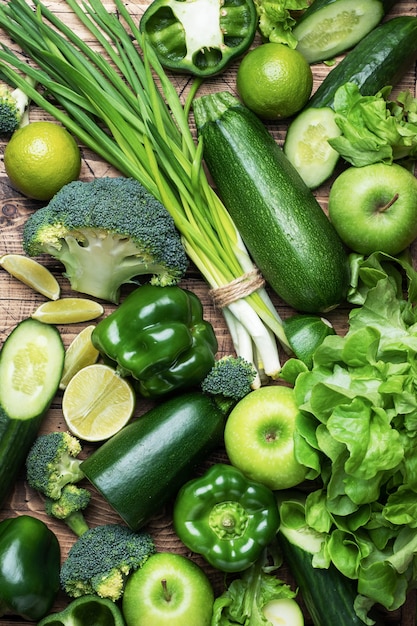 Background of fresh green vegetables and herbs.