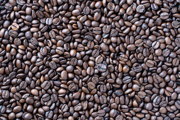 Background of fresh roasted coffee beans close up top view