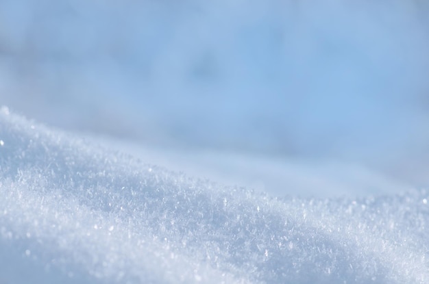 Background of fresh snow texture in blue tone Snow winter background