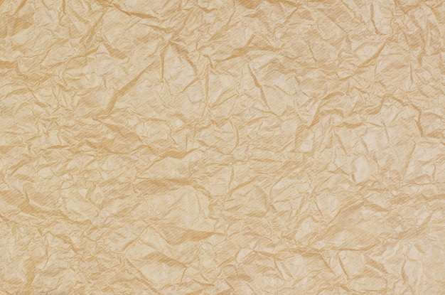 Background from crumpled parchment paper brown wrinkled paper
as background