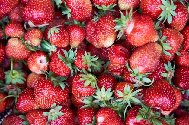 Background from freshly harvested strawberries, Top view of tasty