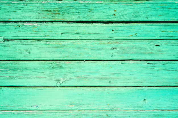 Background from horizontal wooden boards painted green. Abstract background.