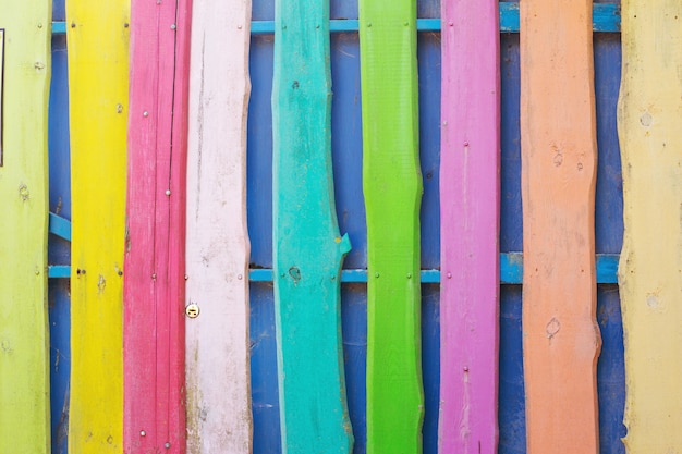 Photo background from  multicolored wooden painted fence