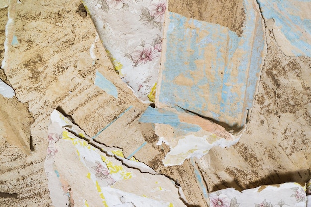 Background from old worn torn grunge dirty peeling wallpapers Abstract surface