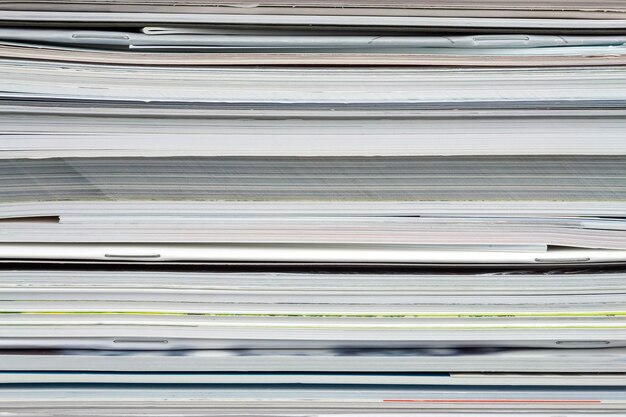 Background from stacked magazines, brochures, notebooks, catalogs