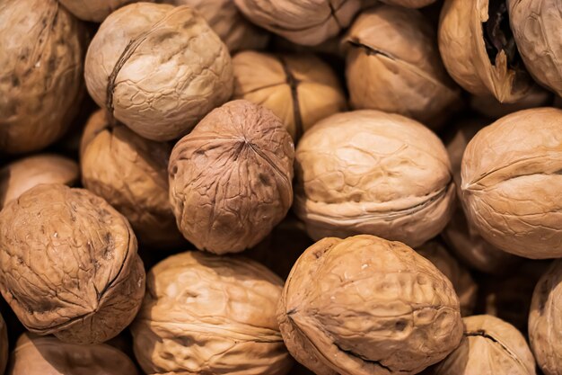 Background from walnuts close up. Healthy Protein Source