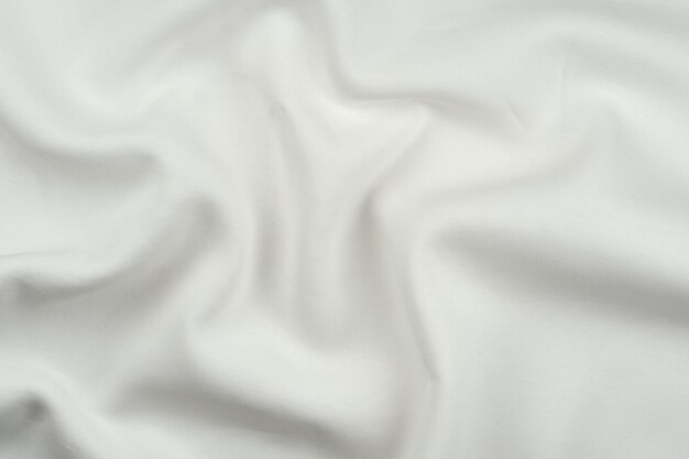 Background from white monochrome cotton fabric close up texture