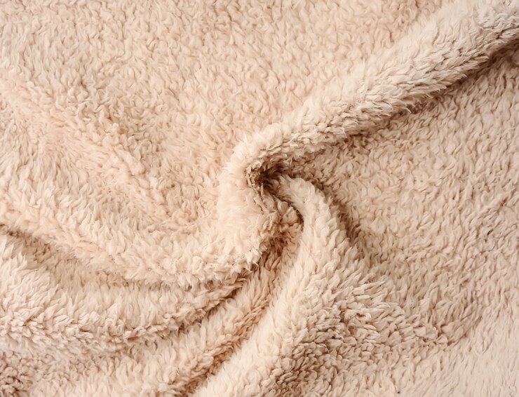 Background of fur beige color closeup.