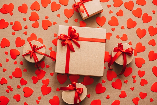 Background of gift boxes and red hearts.