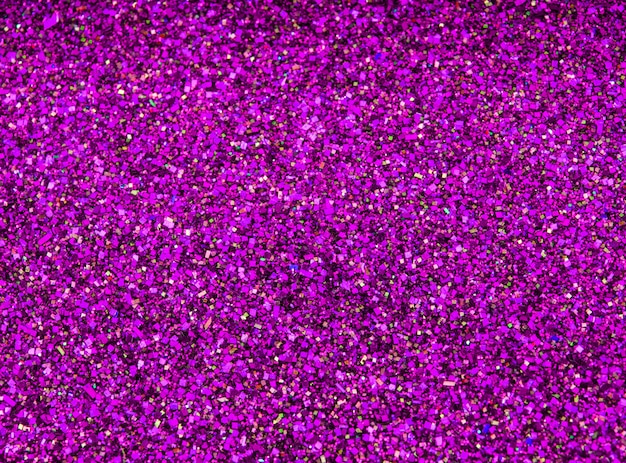 Foto paillettes scintillio di sfondo. sfondo rosa caldo.