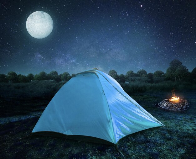 Background glowing night stars and camping in forest.