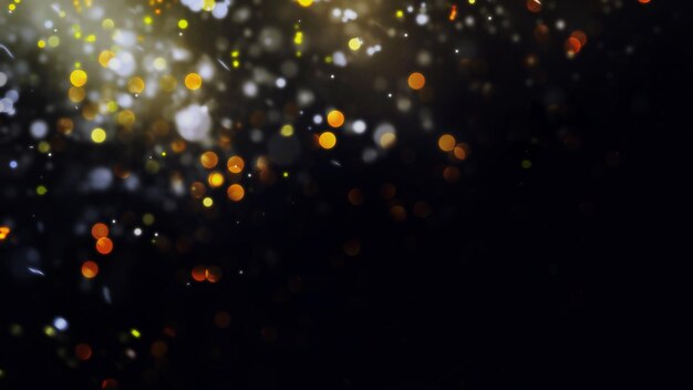 Background of golden defocused lights with copy space Golden confetti defocused over the darkness