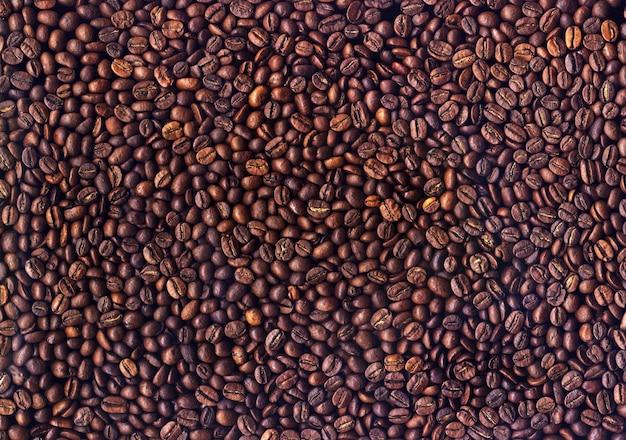 Background of grains of roasted coffee closeup