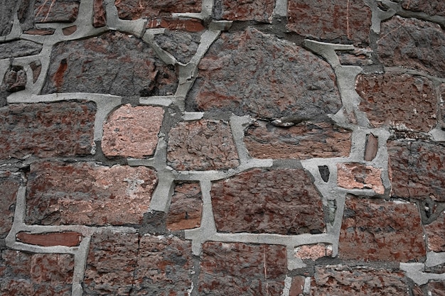 Sfondo di vecchie pietre di granito con cemento