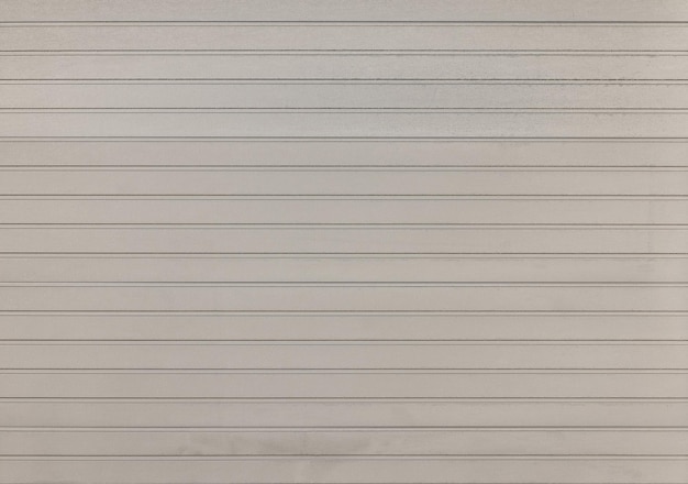 Background of gray and white color painted horizontal metal window roller shutter blinds wood textured