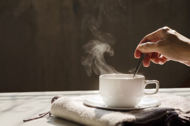 Background of hot black coffee in white ceramic cup