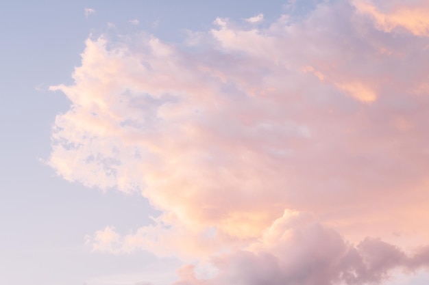 Background image of blue bright sky with pastel pink and white clouds Beautiful sky pattern on clear sunny day