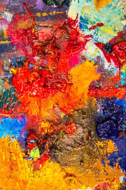 Background image of bright oil-paint palette closeup.