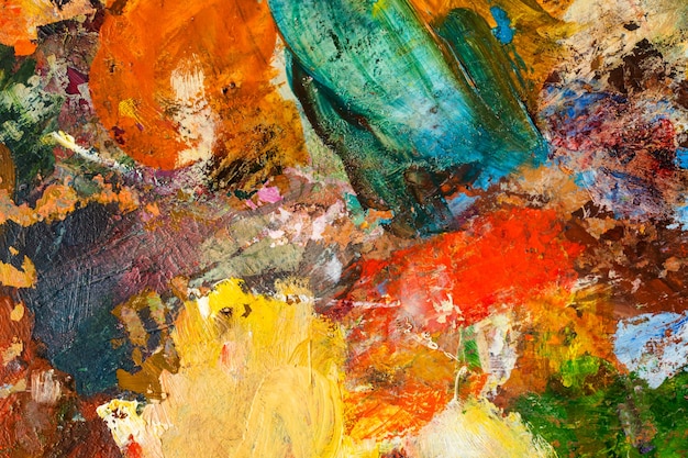 Background image of bright oil-paint palette closeup. Colorfull