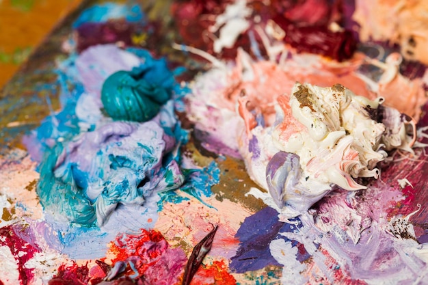 Background image of bright oilpaint palette closeup