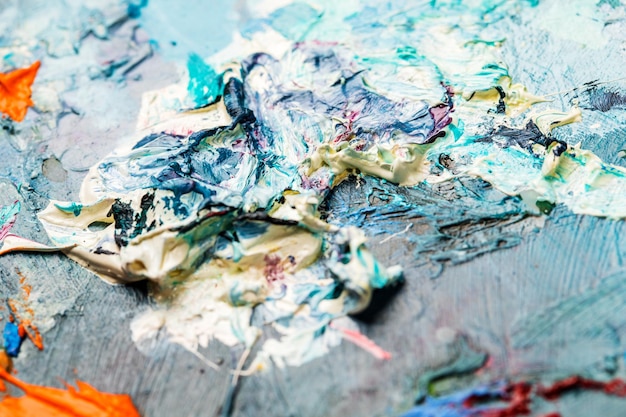 Background image of bright oilpaint palette closeup