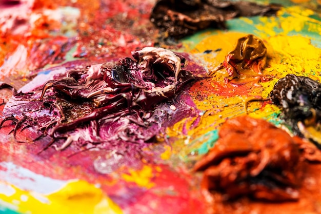 Background image of bright oilpaint palette closeup