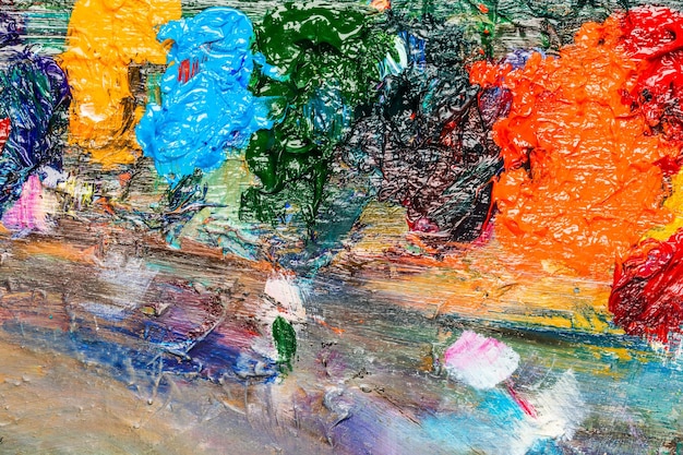 Background image of bright oilpaint palette closeup